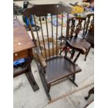 A HIGH BACK MAHOGANY ROCKING CHAIR