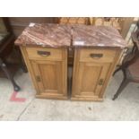 A PAIR OF VICTORIAN PINE POT CUPBOARDS WITH MARBLE TOPS