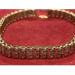 A 9 CARAT GOLD AND DIAMOND BRACELET - APPROXIMATELY TWO CARATS OF DIAMONDS APPROX 19.5CM LONG