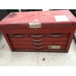 A METAL SIX DRAWER TOOL BOX WITH CONTENTS TO INCLUDE SPANNERS, DRILL BITS, PLIERS ETC.