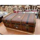 A VINTAGE WOOD BOUND TRAVEL TRUNK WITH INNER SHELD