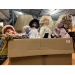 TWELVE ASSORTED PORCELAIN HEADED DOLLS