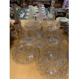 AN ASSORTMENT OF CUT GLASS WARE TO INCLUDE THREE DECANTERS