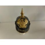 A LEATHER AND BRASS COPY IMPERIAL GERMAN PICKLEHAUBE HELMET, WITH BRASS F.R PLATE