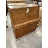 A UNIFLEX RETRO TEAK BUREAU WITH FALL FRONT, TWO DOORS AND TWO DRAWERS