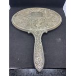 AN EDWARDIAN CONTINENTAL SILVER OVAL EMBOSSED HAND MIRROR