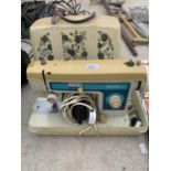 A VINTAGE CASED JONES 300 SEWING MACHINE