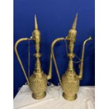 A PAIR OF ORNATE BRASS FLOOR LAMPS IN THE FORM OF MIDDLE EASTERN COFFEE JUGS