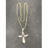 A SILVER ORNATE CROSS AND CHAIN
