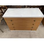 A MODERN MELAMINE CASED CHEST OF FOUR DRAWERS