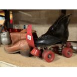 A VINTAGE PAIR OF ROLLER SKATES AND A VINTAGE PAIR OF COWBOY BOOTS SIZE 7