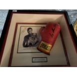 A FRAMED AND SIGNED 'SUGAR' SHANE MOSLEY BOXING GLOVE AND PICTURE. NO COA