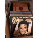 A LARGE COLLECTION OF RECORDS TO INCLUDE 'ELVIS 40 GREATEST' AND 'NOW THATS WHAT I CALL MUSIC 2'