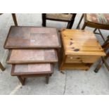 A NEST OF THREE TEAK TILE-TOP TABLES AND A PINE BEDSIDE LOCKER