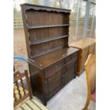 AN OAK JAYCEE DRESSER COMPLETE WITH PLATE RACK, 48" WIDE