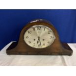 A LARGE WOODEN NAPOLEON'S HAT MANTEL CLOCK