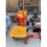 A CHILDREN'S PLAY CEMENT MIXER AND WHEELBARROW