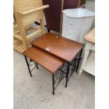 A NEST OF TWO MAHOGANY TABLES AND A SMALL, SHAPED CHEST OF FIVE DRAWERS