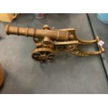 AN ORNATE BRASS CANNON