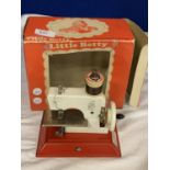 A VINTAGE CHILD'S 'LITTLE BETTY' BOXED SEWING MACHINE
