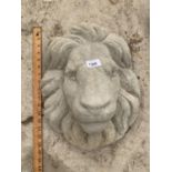 A STONE EFFECT LION FACE WALL PLAQUE