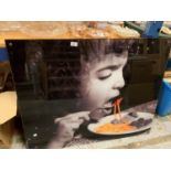 LARGE LAMINATED IMAGE OF GIRL EATING SPAGHETTI