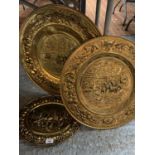 THREE DECORATIVE BRASS PLATTERS DEPICTING WORKING HORSES