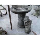 TWO CONCRETE GARDEN ORNAMENTS - A BIRDBATH AMD A CHERUB