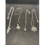 FOUR SILVER NECKLACES