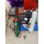 A COMPOUND MITRE SAW, HEDGE TRIMMER, DRILL AND BATTERY CHARGER IN W/O