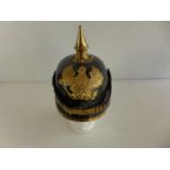 A LEATHER AND BRASS COPY IMPERIAL GERMAN OFFICERS PICKLEHAUBE, WITH BRASS F.R PLATE