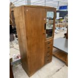 A RETRO TEAK WARDROBE WITH TWO DOORS AND FIVE DRAWERS