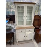 AN OAK AND PAINTED CABINET WITH TWO LOWER DOORS AND DRAWERS AND TWO UPPER GLAZED DOORS