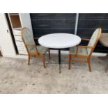 A CIRCULAR KITCHEN TABLE AND TWO CHAIRS