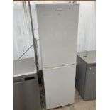 A WHITE LEC UPRIGHT FRIDGE FREEZER BELIEVED IN WORKING ORDER BUT NO WARRANTY