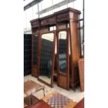 A NINETEENTH CENTURYTRIPLE MIRROR CONTINENTAL WARDROBE WITH BRASS FITTINGS AND APPLIED DECORATION