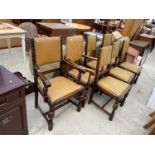 A SET OF SIX OAK JACOBEAN STYLE DINING CHAIRS AND ONE SIMILAR CHAIR WITH STUDDED AND UPHOLSTERED