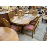 A CONTINENTAL STYLE EXTENDING DINING TABLE, 84x42" FULLY EXTENDED AND EIGHT DINING CHAIRS WITH SPLIT