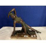 A SPELTER FEMALE FIGURINE IN THE ART DECO STYLE ON A MARBLE BASE (BASE A/F)