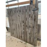 A VERY LARGE SLATTED WOODEN YARD GATE, WIDTH 182CM, HEIGHT 180CM