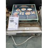 AN ELECTRIC GRIDDLE AND A MICROWAVE TIME SAVING COLLECTION