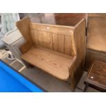 A PINE PEW STYLE BENCH SEAT
