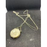 A WHITE METAL POSIBBLY SILVER CHAIN WITH A LOCKET STYLE PURSE IN THE FORM OF A COIN