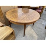 A CIRCULAR TEAK G-PLAN DINING TABLE, 48" DIAMETER, TOGETHER WITH AN EXTRA LEAF 18"