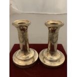 A PAIR OF VINTAGE SILVER CANDLESTICKS