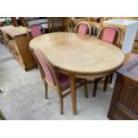 A MODERN EXTENDING DINING TABLE AND FOUR CHAIRS