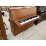 A CAMEO TEAK UPRIGHT PIANO