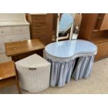 A LLOYD LOOM CORNER LINEN BASKET AND A KIDNEY SHAPED DRESSING TABLE