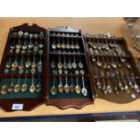 THREE WOODEN SPOON COLLECTORS RACKS WITH SPOONS