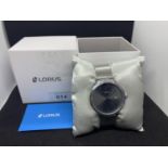 A NEW AND BOXED LORUS CALENDAR WRIST WATCH IN WORKING ORDER